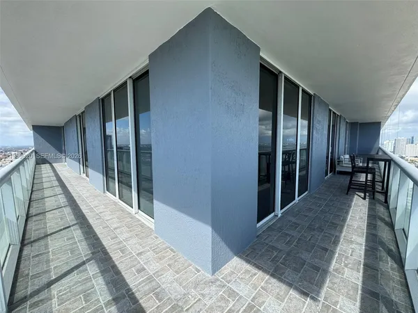 a swimming pool with outdoor seating and yard