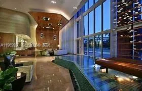 a view of swimming pool with outdoor seating