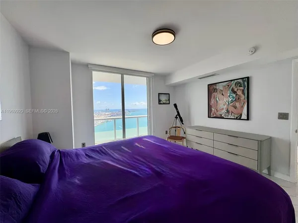 a view of a hallway with entryway and furniture