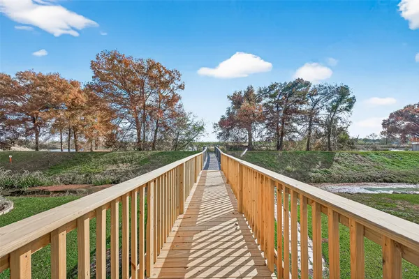 a view of a house with wooden deck