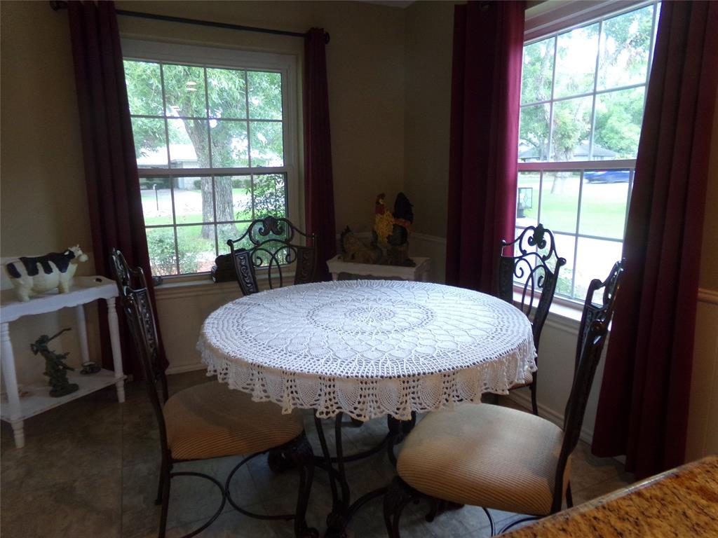 5110 Wedgefield Road Granbury, TX 76049 - Photo 14 of 23 Dining area featuring two large windows with grid patterns