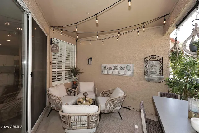 a spacious bedroom with a bed a dresser and a flat screen tv