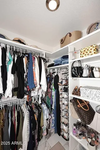a en suite bathroom with a granite countertop sink and a mirror