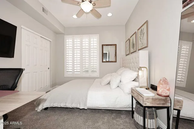 a bedroom with a bed and furniture