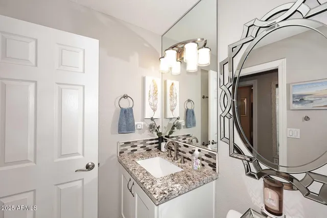 a bathroom with a shower and a sink