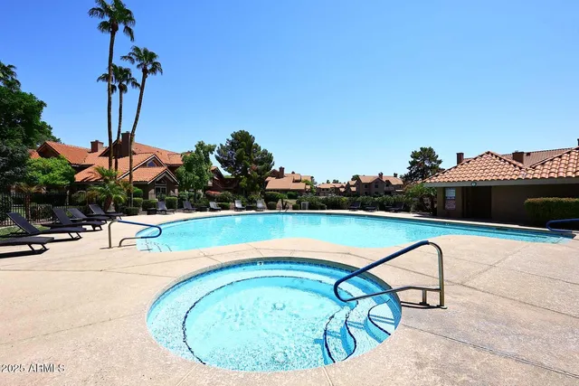 a building outdoor space with patio furniture and potted plants