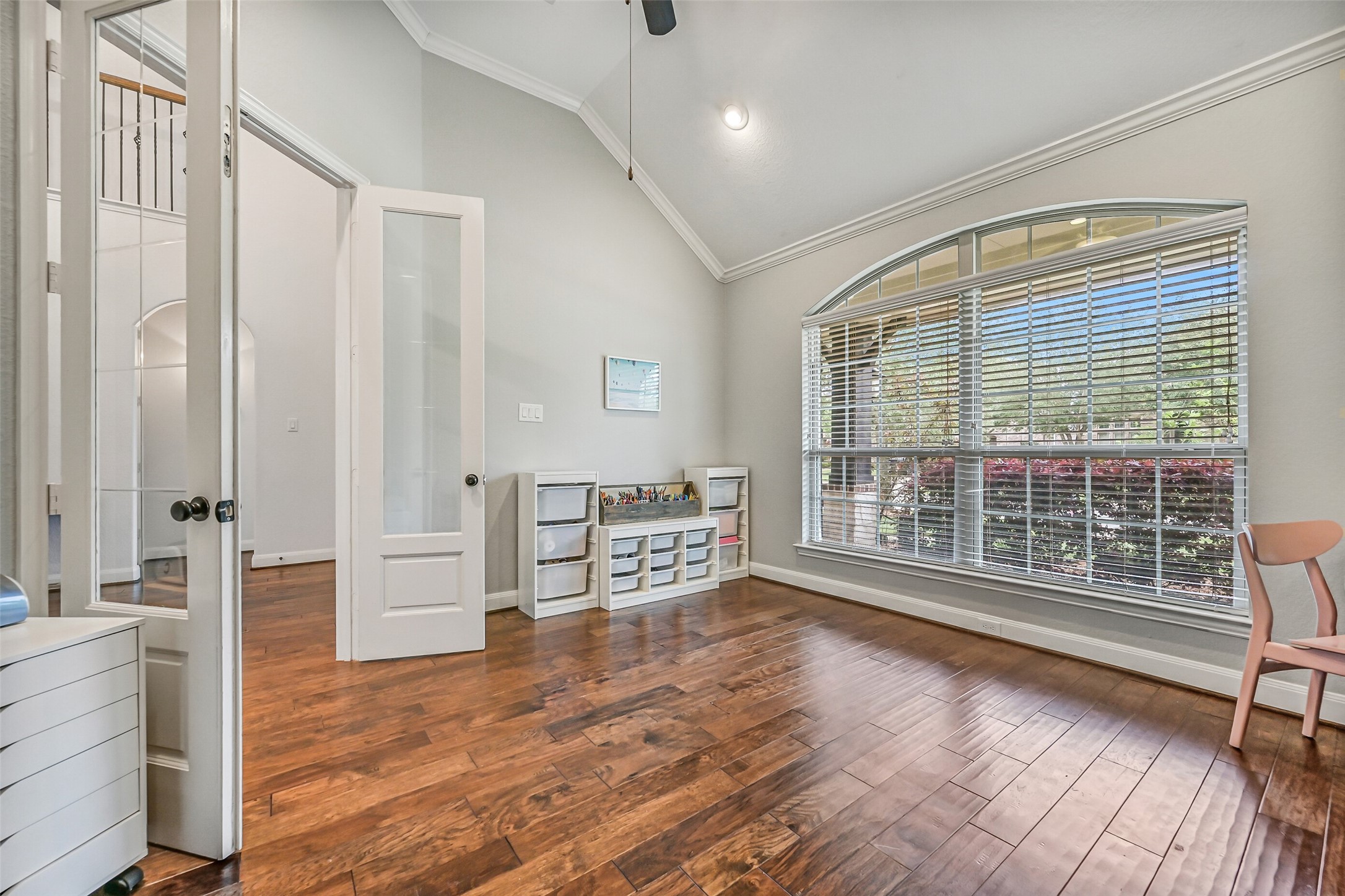 1008 Point Isabel Lane Friendswood, TX 77546 - Photo 9 of 50 A second view of the study highlights its versatility and generous proportions, with 8-foot double French doors, an elevated gambrel ceiling, and an open feel that allows for a variety of uses to fit your needs.
