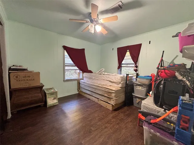 a bedroom with bed and a chandelier