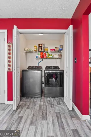 a utility room with washer and dryer