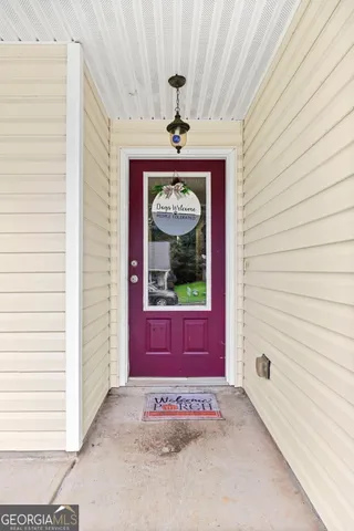 a view of a hallway with a chandelier