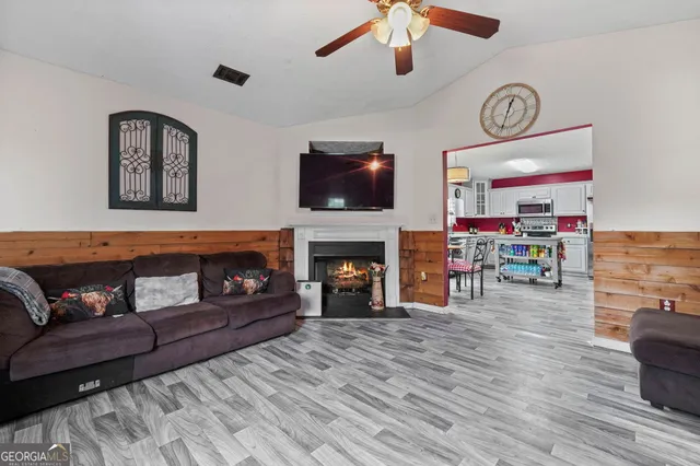 a living room with furniture and a fireplace