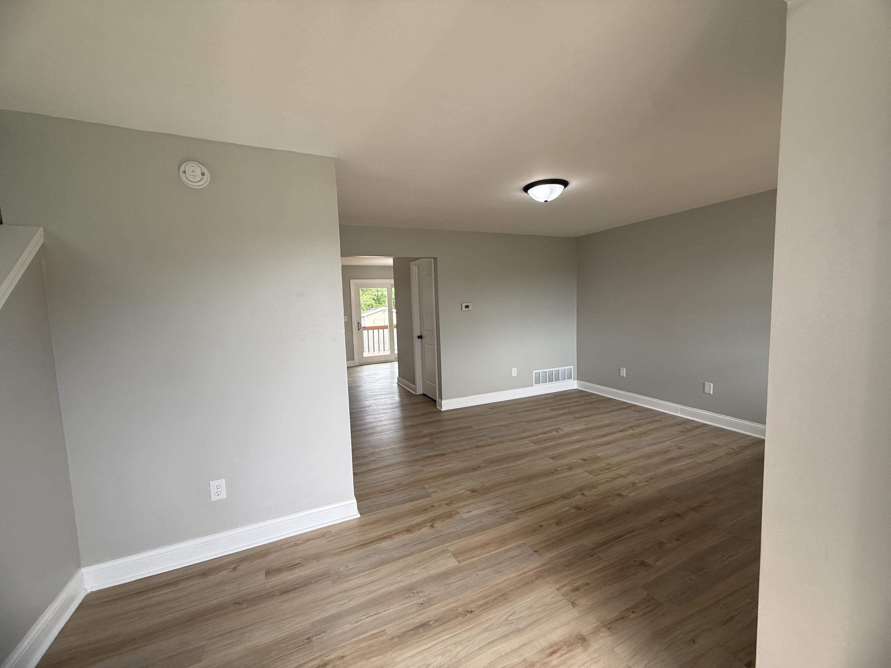 15895 Sherman Street Lowell, IN 46356 - Photo 6 of 36 a view of empty room with wooden floor