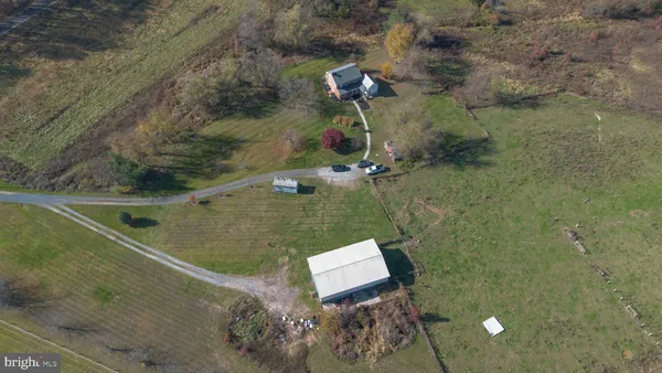 an aerial view of a house with a yard