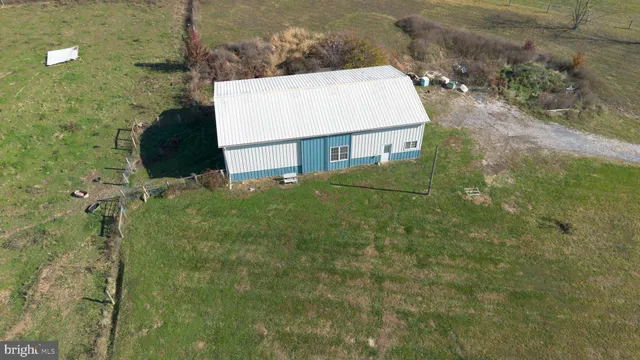 a aerial view of a house with a lake view
