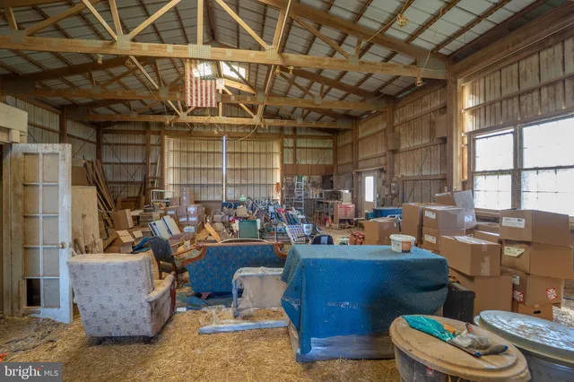 a view of a house with backyard and tree