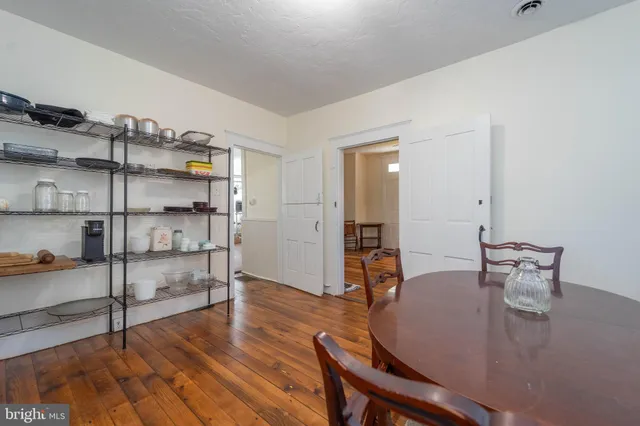 a living room with furniture a rug and a chandelier