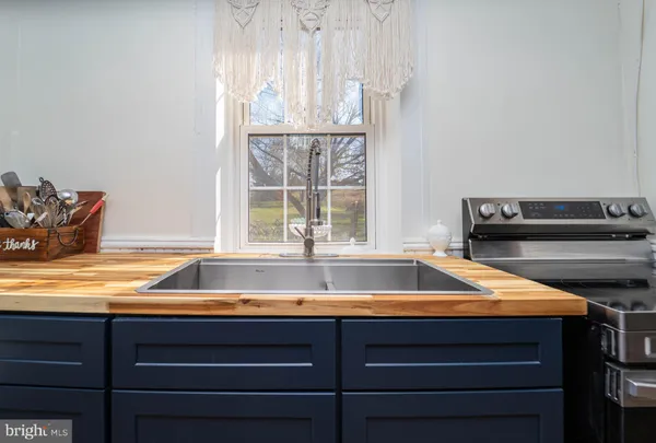 a kitchen with a stove and a refrigerator
