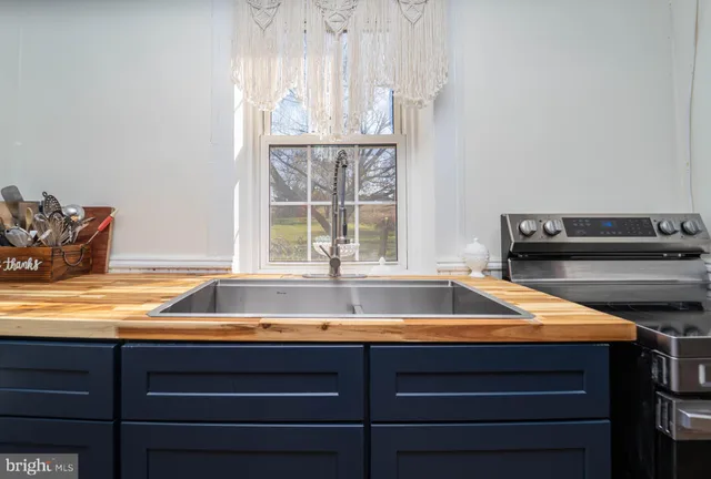 a kitchen with a stove and a refrigerator