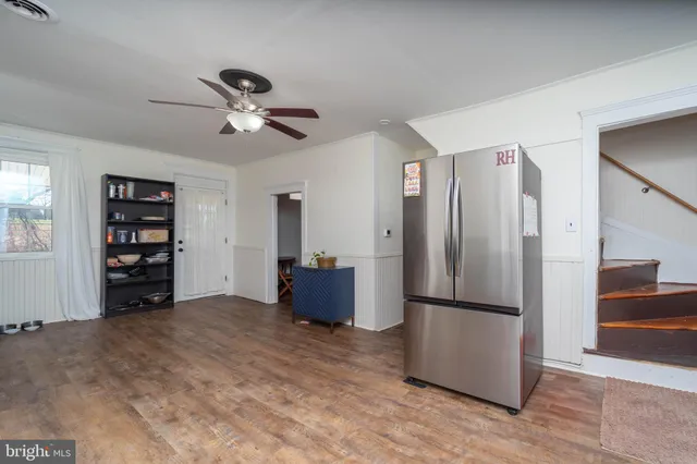 a view of a bedroom with furniture and staircase
