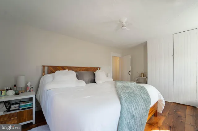 a spacious bathroom with a granite countertop tub sink and mirror