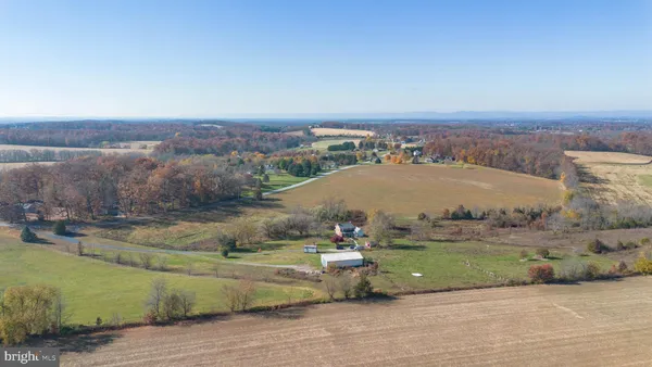 an aerial view of a houses with outdoor space