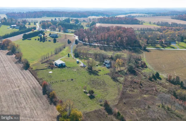 an aerial view of a house with a lake view