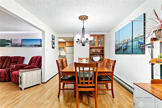 a view of a dining room with furniture and wooden floor