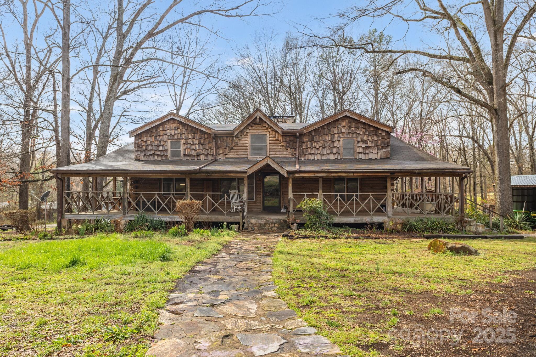 723 Hill Everhart Road Lexington, NC 27295 - Photo 2 of 48 a front view of a building with a garden