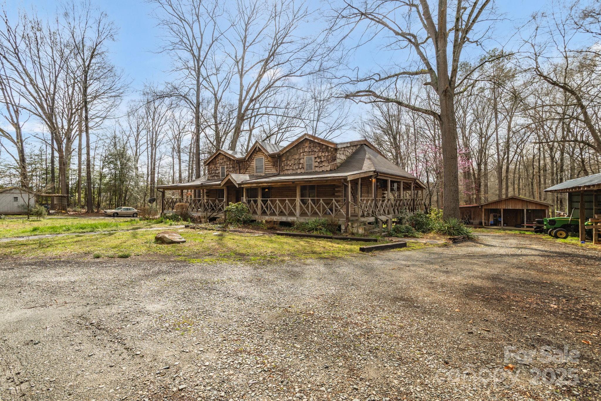 723 Hill Everhart Road Lexington, NC 27295 - Photo 3 of 48 a view of a house with a big yard and large trees