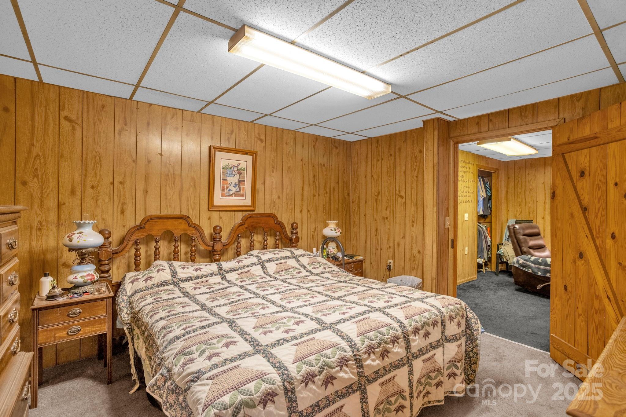 723 Hill Everhart Road Lexington, NC 27295 - Photo 31 of 48 a bedroom with a bed and a mirror