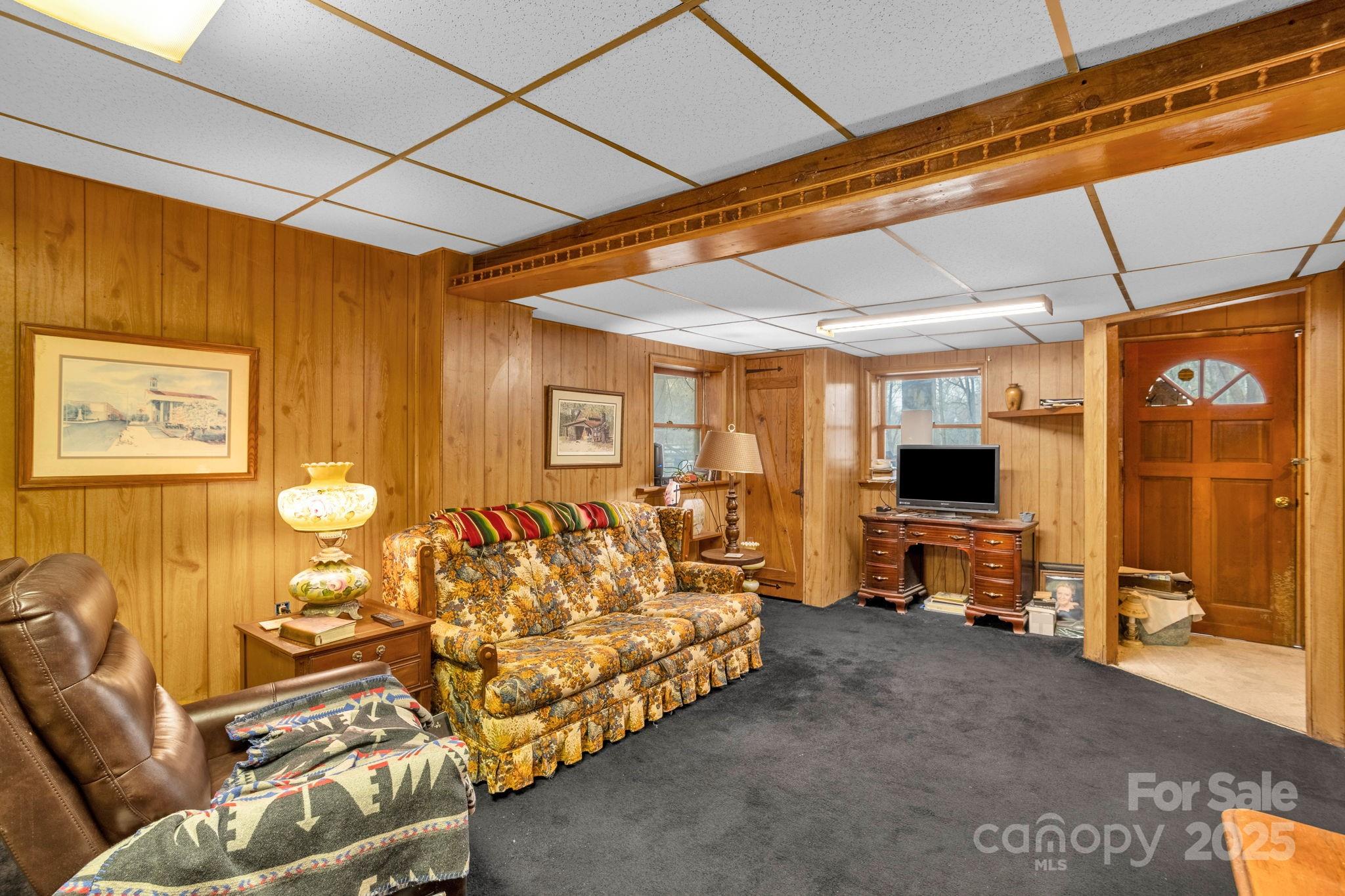 723 Hill Everhart Road Lexington, NC 27295 - Photo 33 of 48 a bedroom with furniture and a flat screen tv