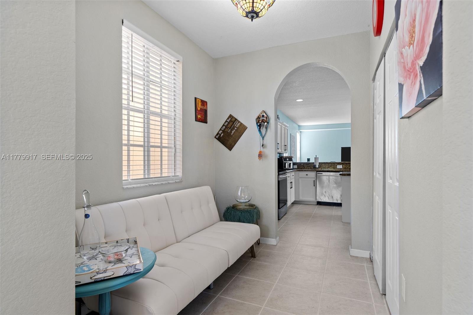 13990 Southwest 274th Terrace Homestead, FL 33032 - Photo 15 of 60 a living room with furniture and a large window