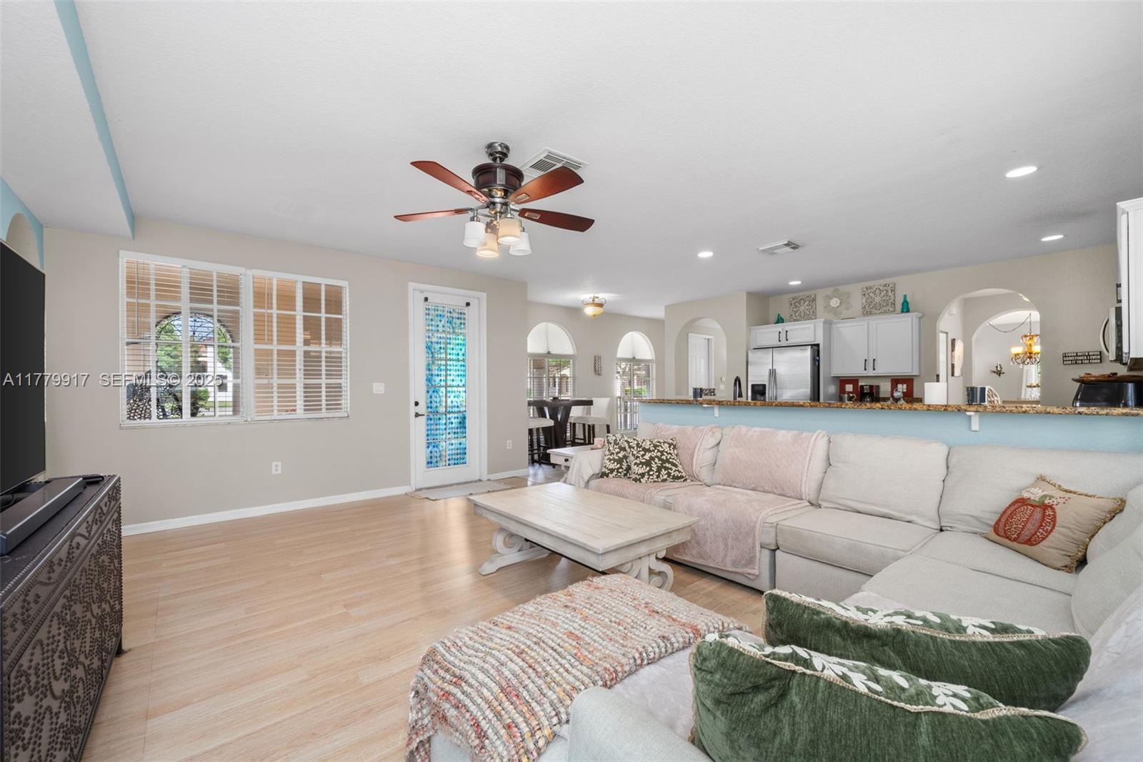 13990 Southwest 274th Terrace Homestead, FL 33032 - Photo 17 of 60 a living room with furniture and a large window