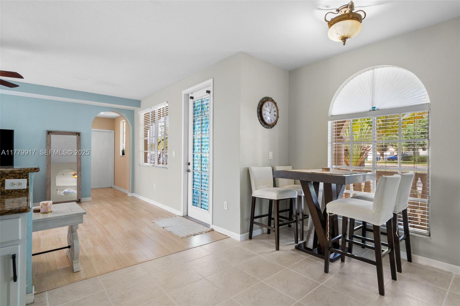 13990 Southwest 274th Terrace Homestead, FL 33032 - Photo 20 of 60 a view of a dining room with furniture and a window