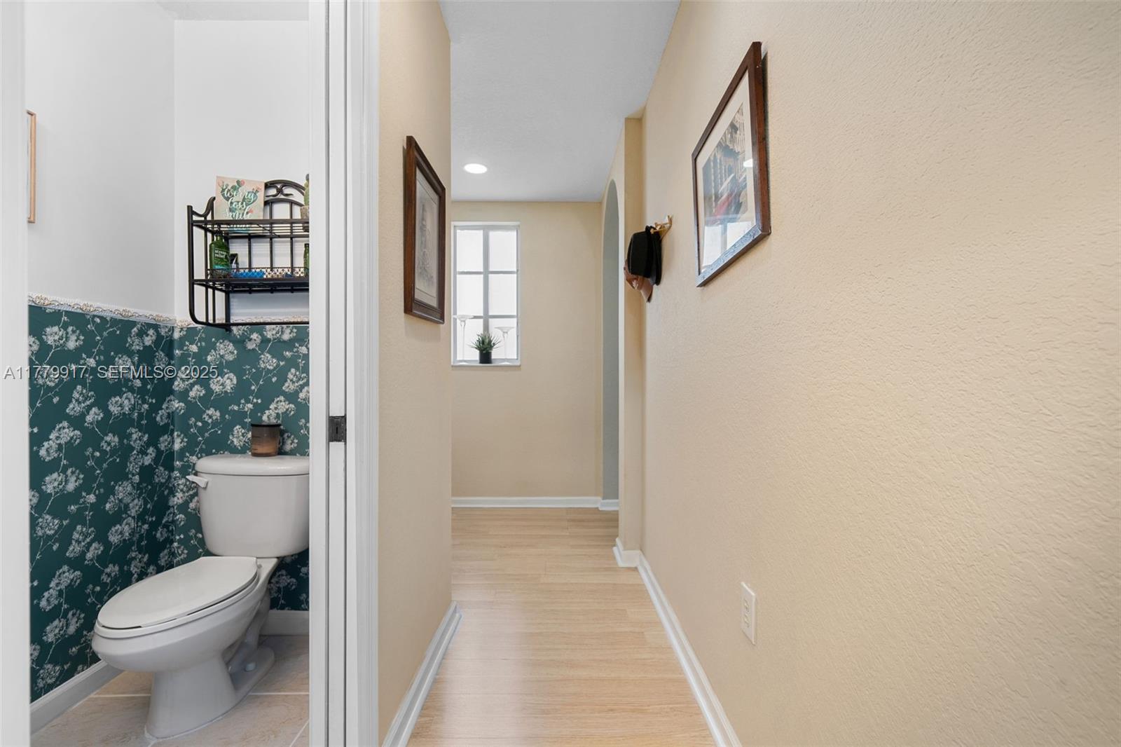 13990 Southwest 274th Terrace Homestead, FL 33032 - Photo 26 of 60 a bathroom with a toilet and a mirror