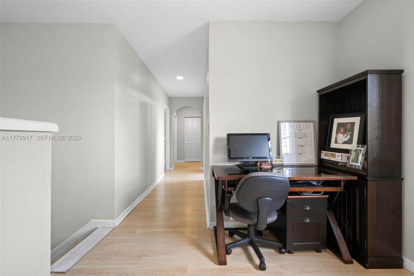 13990 Southwest 274th Terrace Homestead, FL 33032 - Photo 28 of 60 a view of a workspace with furniture and a window