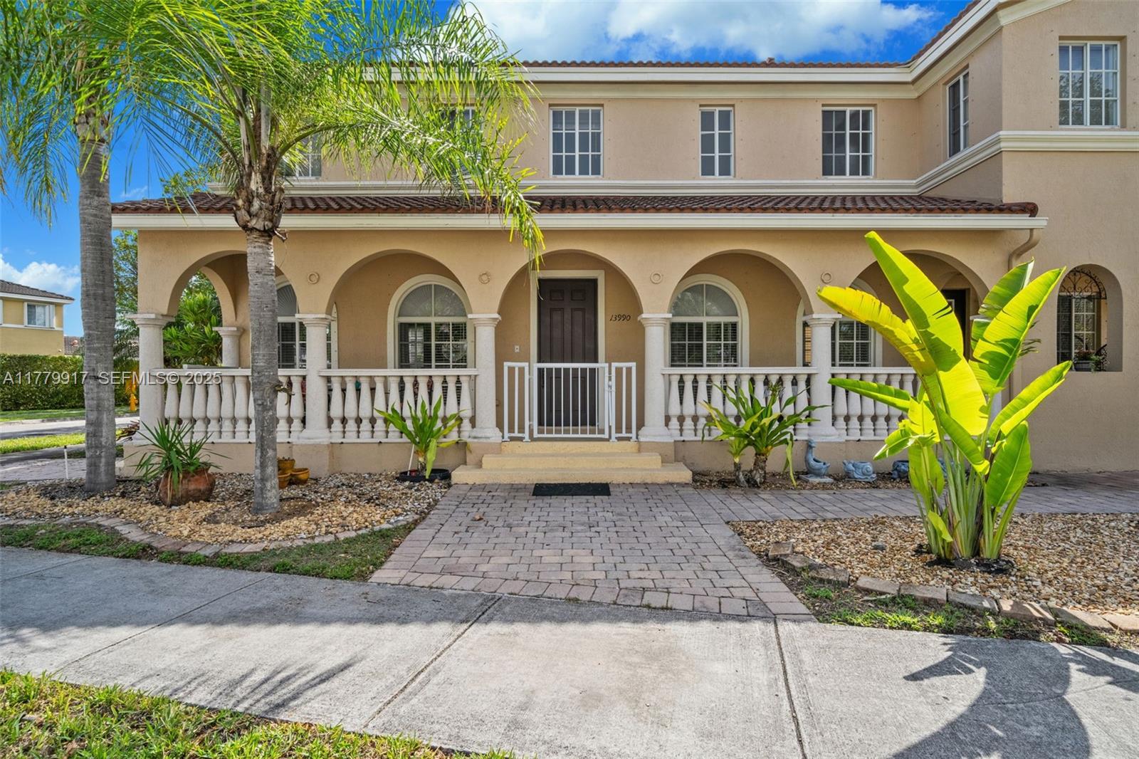 13990 Southwest 274th Terrace Homestead, FL 33032 - Photo 3 of 60 a front view of a house with garden
