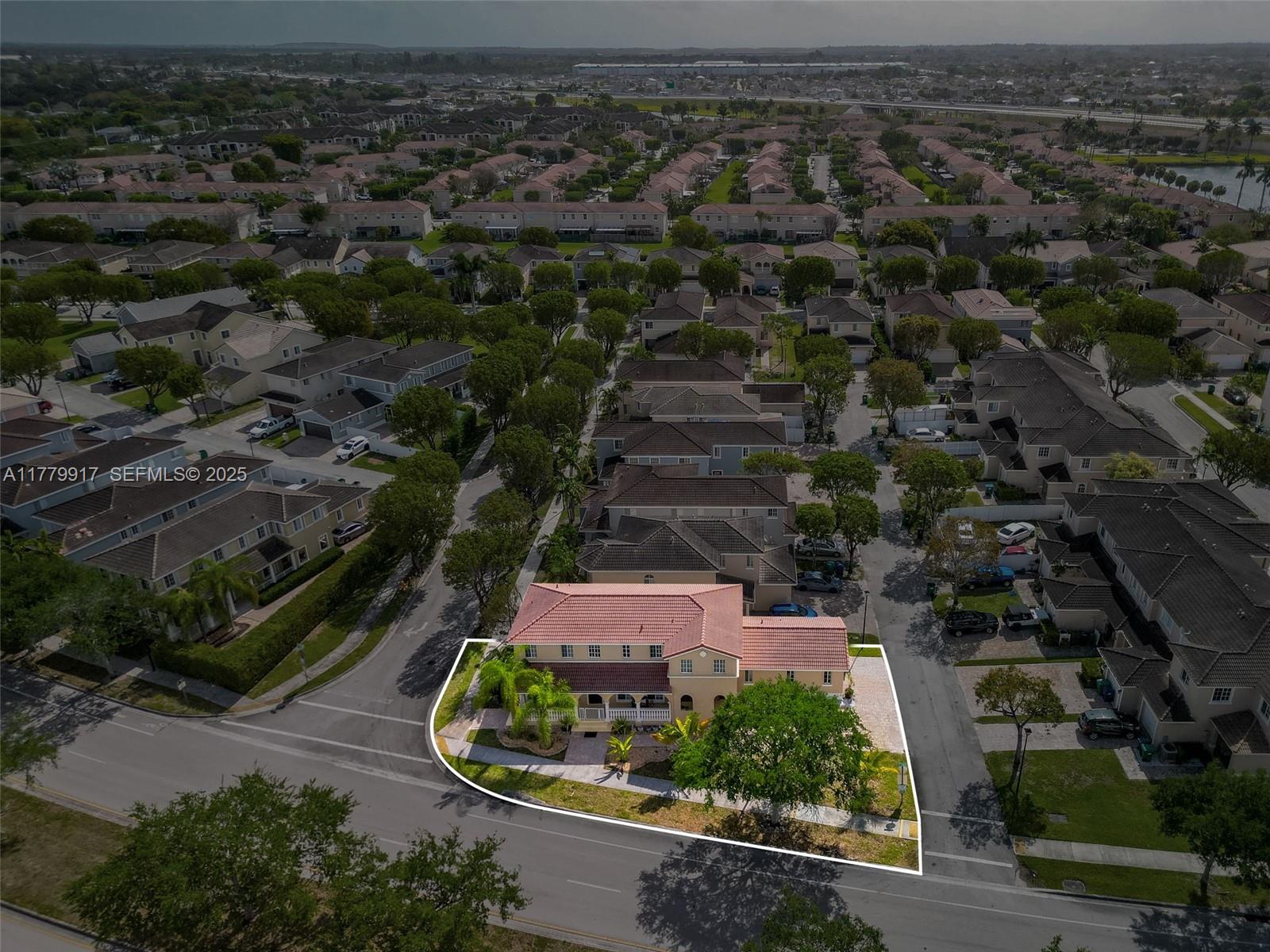 13990 Southwest 274th Terrace Homestead, FL 33032 - Photo 47 of 60 an aerial view of a house with a yard and lake view