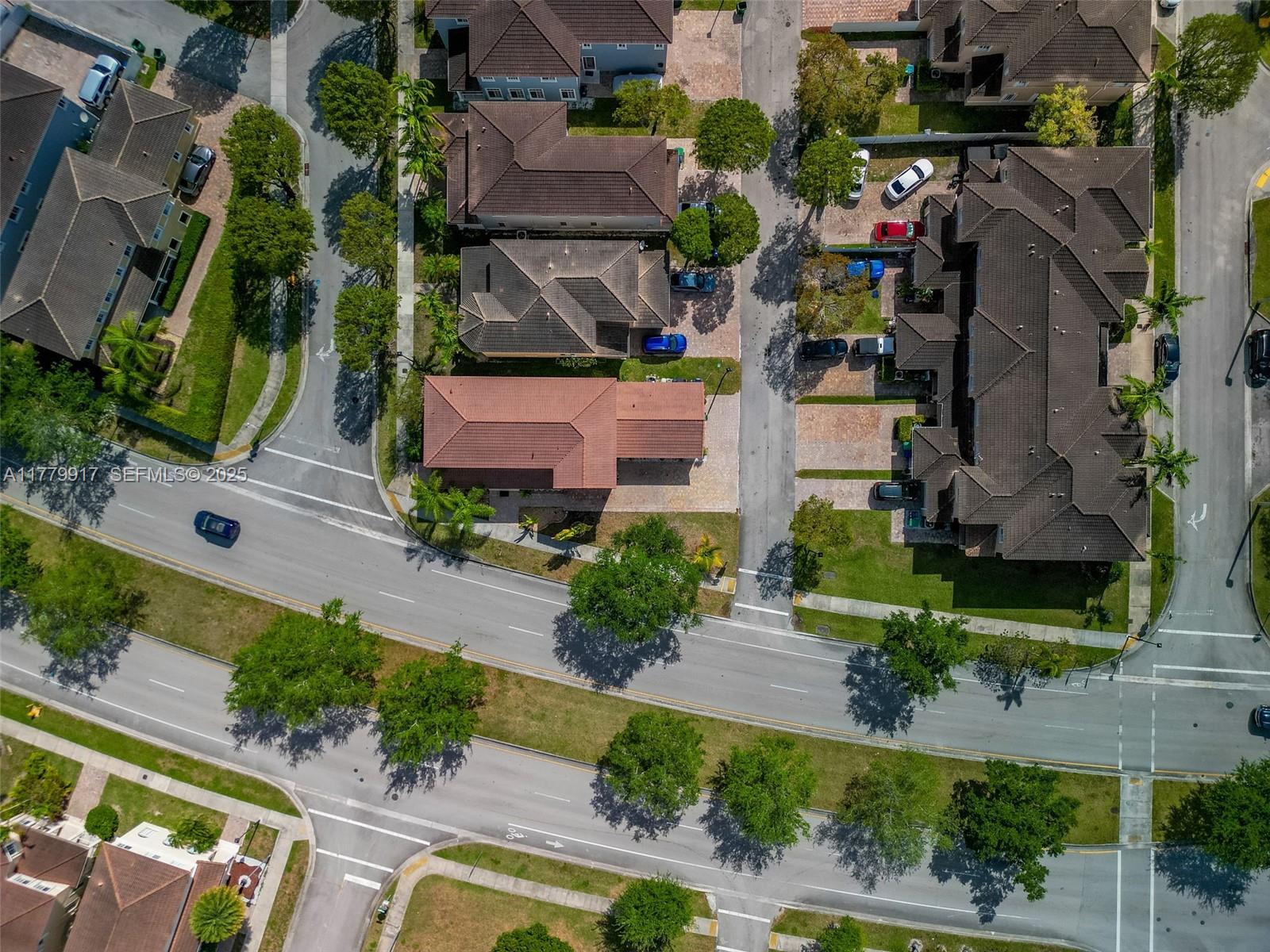 13990 Southwest 274th Terrace Homestead, FL 33032 - Photo 56 of 60 an aerial view of multiple houses with yard