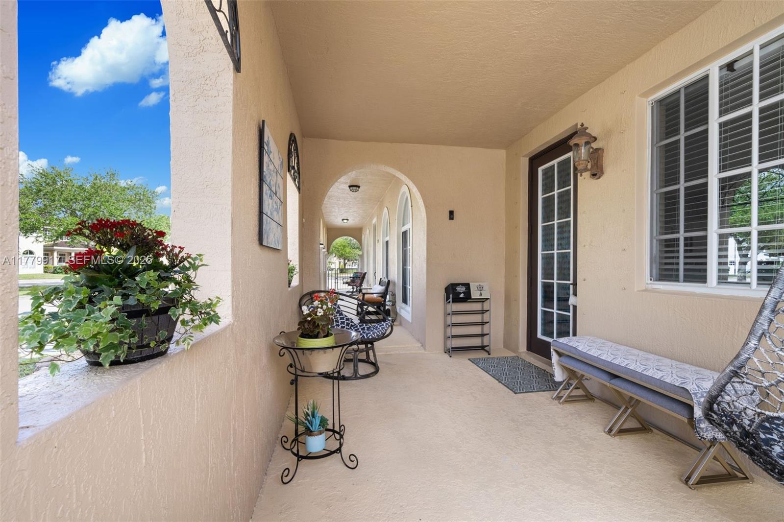 13990 Southwest 274th Terrace Homestead, FL 33032 - Photo 6 of 60 a view of a room with gym equipment and potted plants