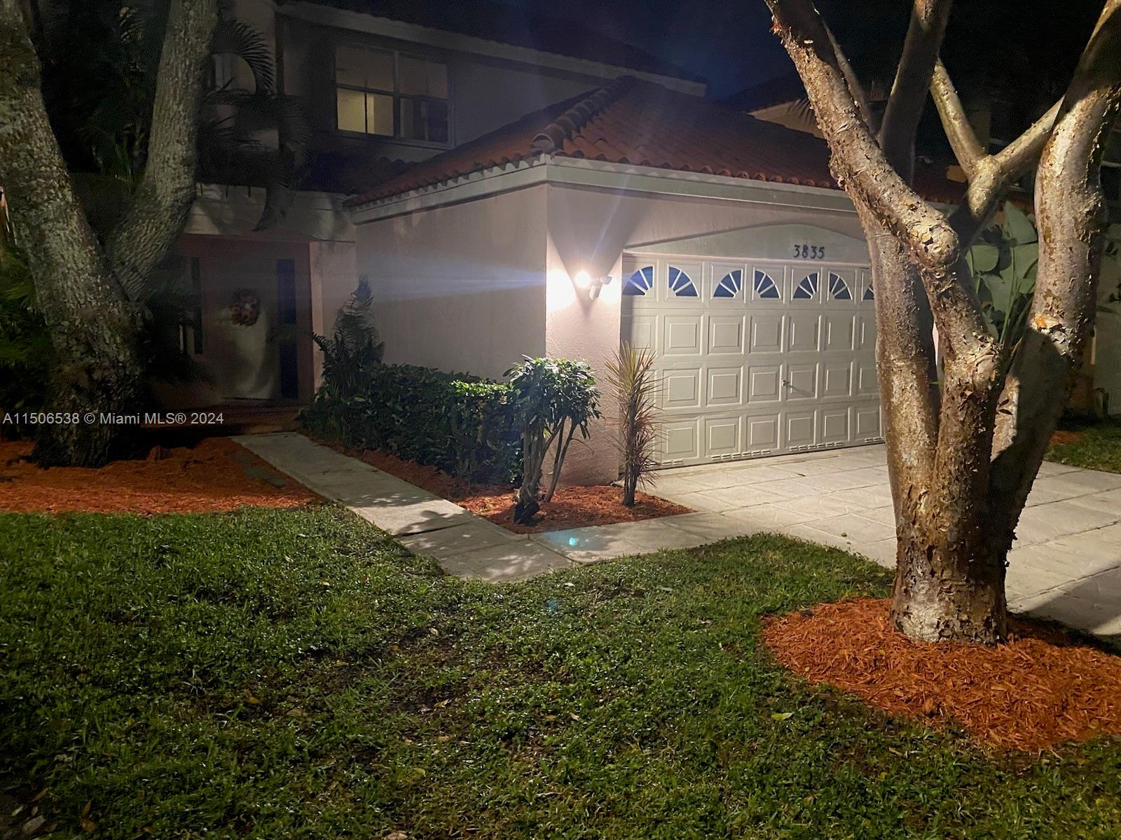3835 Lombardy Street Hollywood, FL 33021 - Photo 19 of 20 a backyard of a house with lots of green space