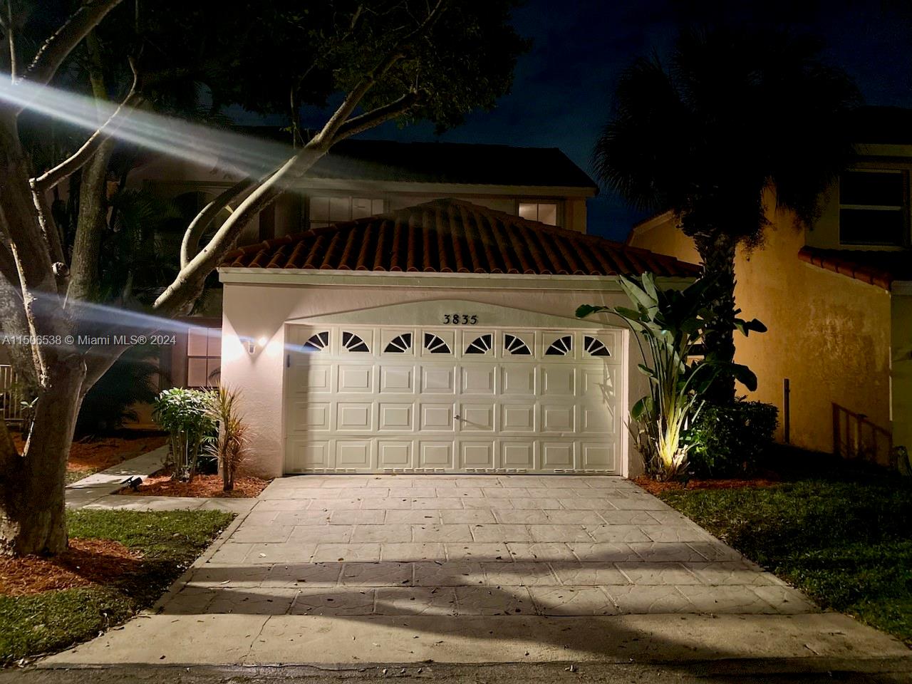 3835 Lombardy Street Hollywood, FL 33021 - Photo 20 of 20 a front view of a house with a yard