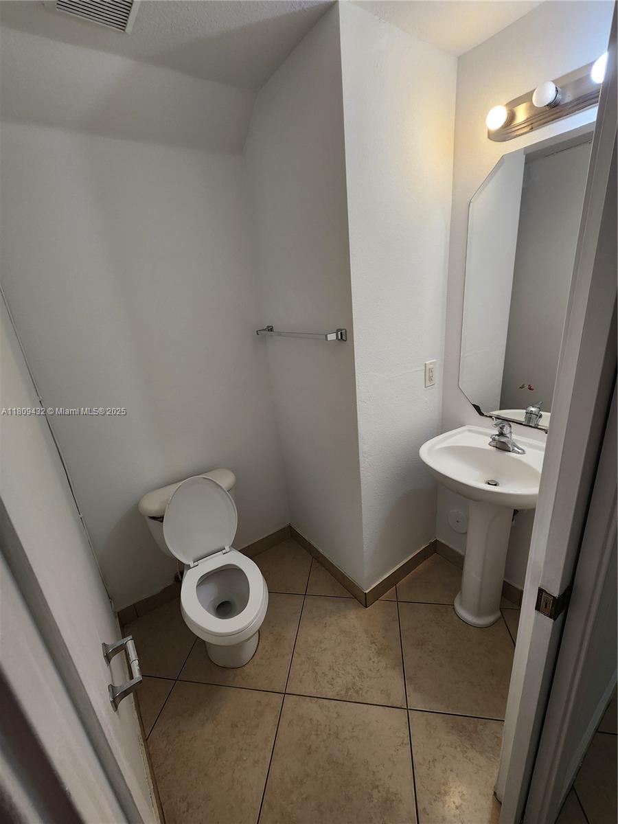 Miramar Miramar, FL 33025 - Photo 13 of 37 a bathroom with a sink and a toilet