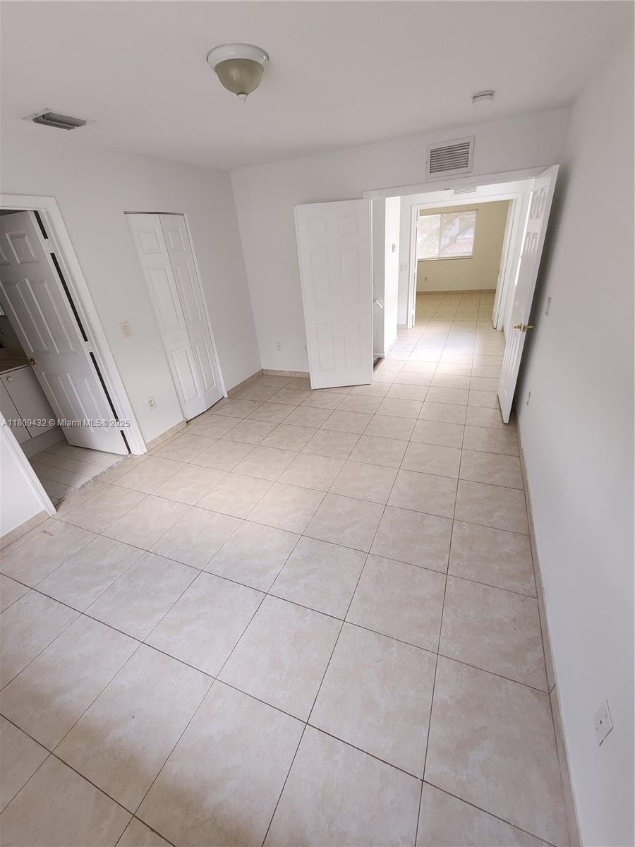 Miramar Miramar, FL 33025 - Photo 15 of 37 a view of a livingroom with an empty space and a window