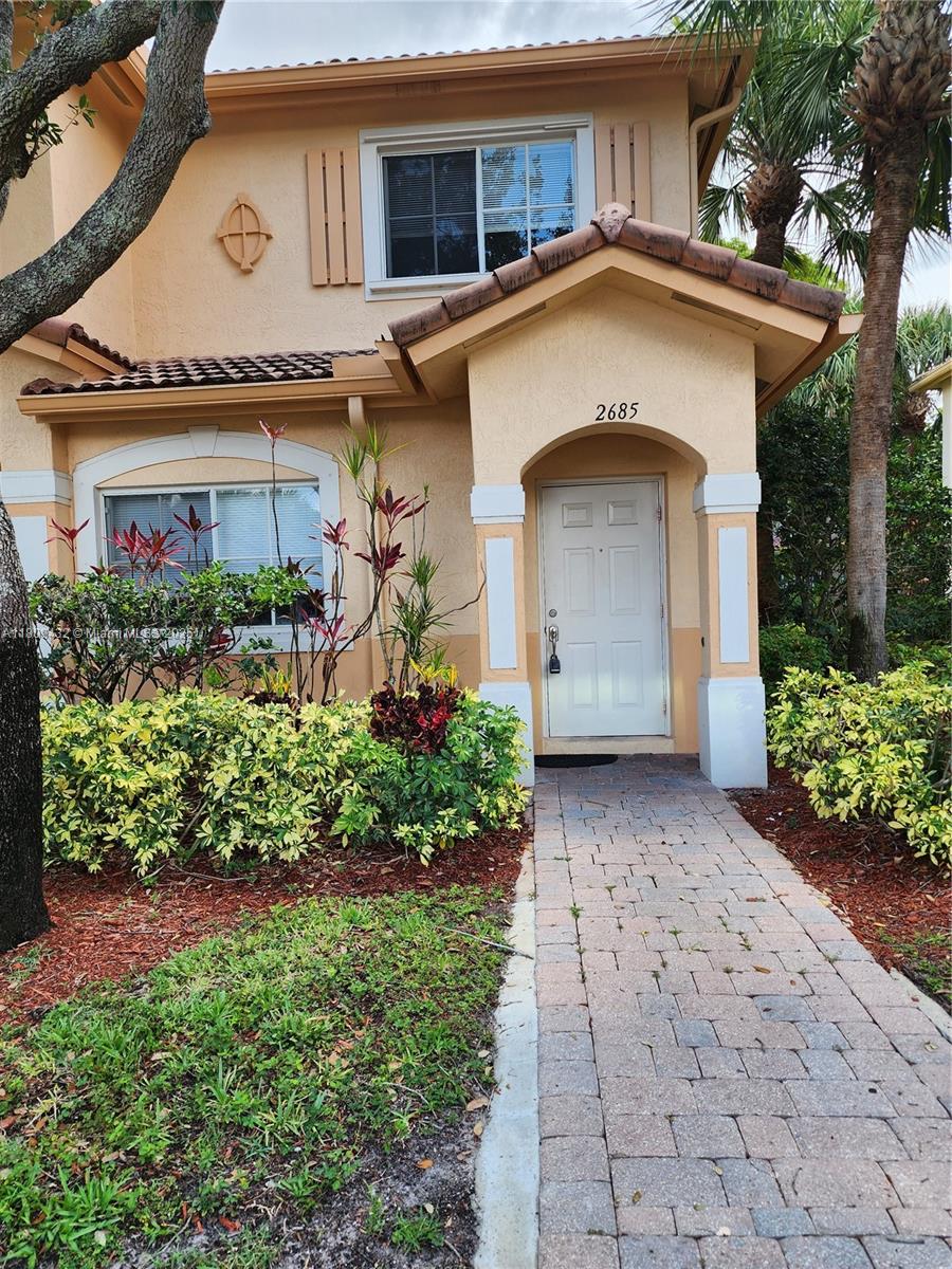Miramar Miramar, FL 33025 - Photo 2 of 37 a front view of a house with a garden