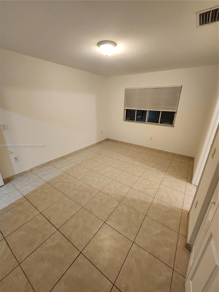 Miramar Miramar, FL 33025 - Photo 24 of 37 an empty room with a empty space and garage view
