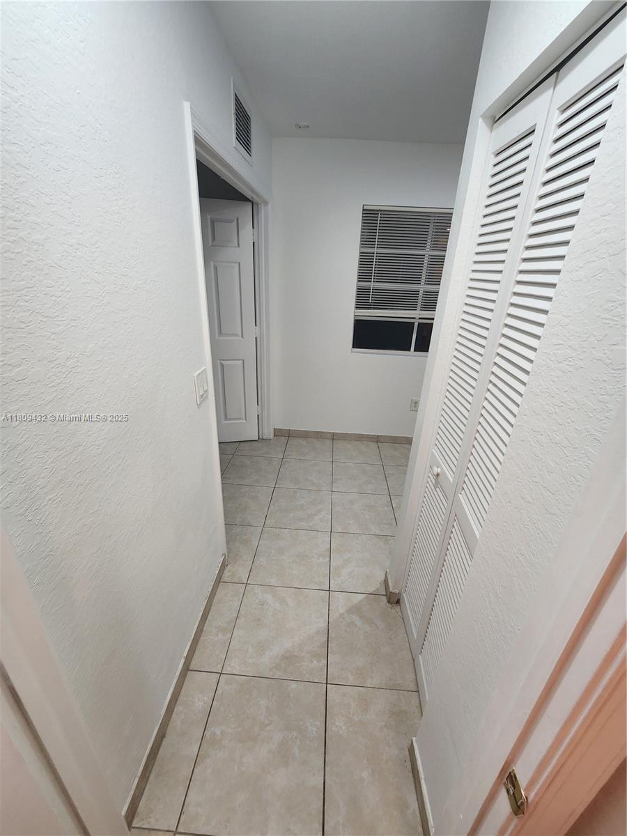 Miramar Miramar, FL 33025 - Photo 25 of 37 a view of a livingroom with an empty space and a window