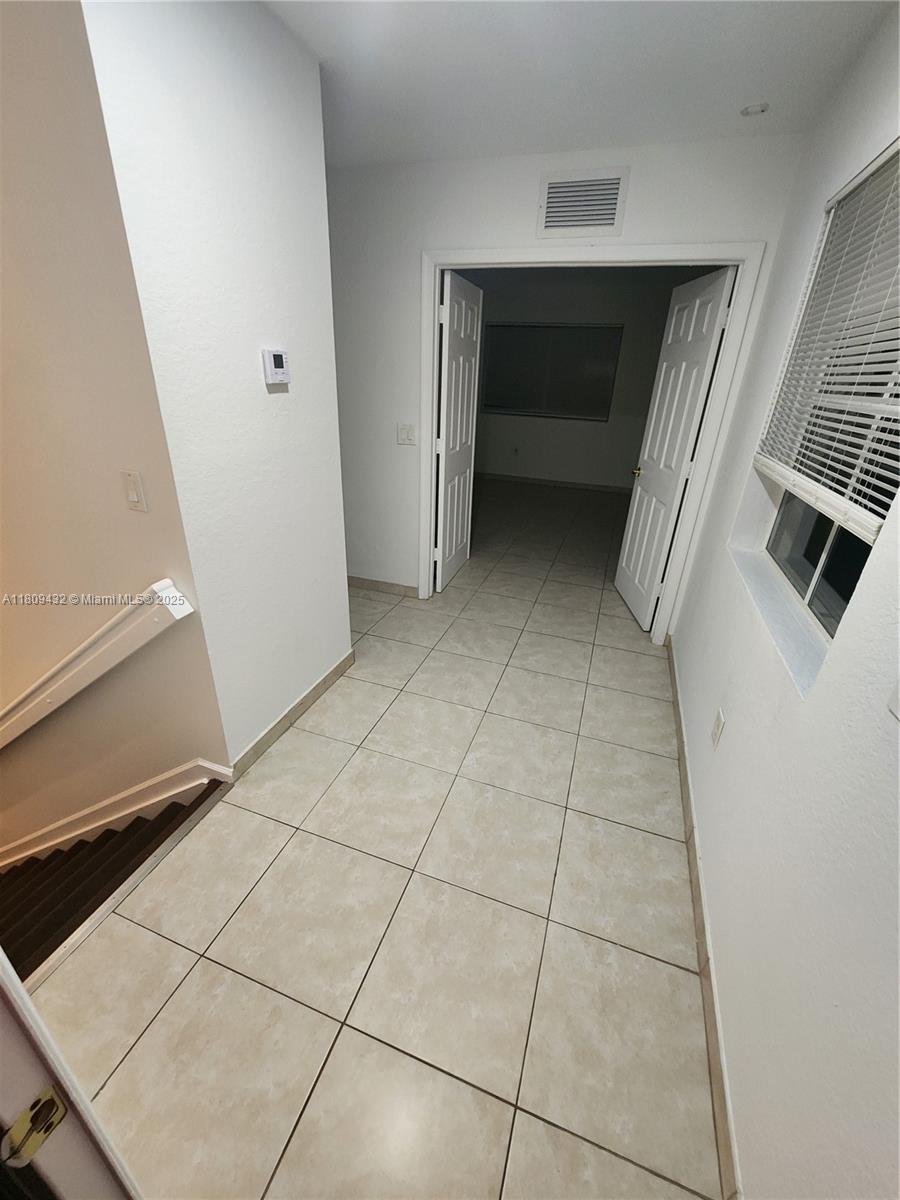 Miramar Miramar, FL 33025 - Photo 27 of 37 a view of a livingroom with an empty space and a fireplace