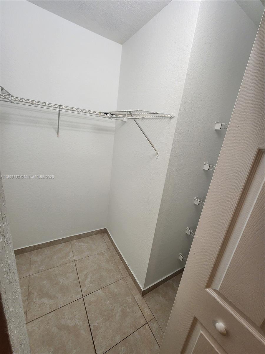 Miramar Miramar, FL 33025 - Photo 28 of 37 a view of an empty walk in closet
