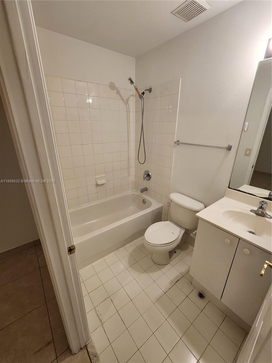 Miramar Miramar, FL 33025 - Photo 31 of 37 a bathroom with a granite countertop sink a toilet and shower